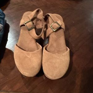 Brown suede Mary janes.
